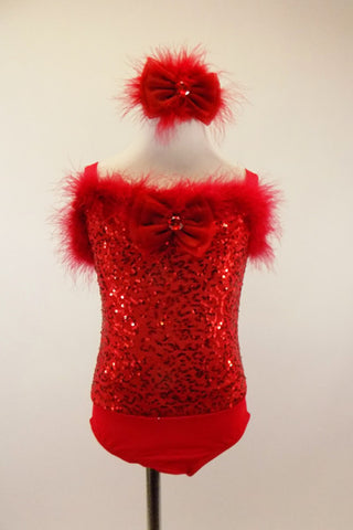 Red leotard has sequined bodice with marabou trim and a large jeweled bow at front. Comes with matching jeweled bow/feather hair accessory. Front