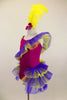 Magenta camisole biketard has crystals & feather accents. Asymmetrical  purple & yellow ruffle crosses the bodice & open front bustle. Has yellow hair feather. Left side