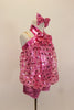 Heart sequin pink blouson top is attached to a metallic pink biketard with metallic yolk & halter straps. Has large sequined bow tie & matching hair accessory. Right side