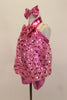 Heart sequin pink blouson top is attached to a metallic pink biketard with metallic yolk & halter straps. Has large sequined bow tie & matching hair accessory. Left side