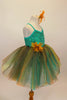 Aqua  jewel-tone tutu dress has sequin spandex front with cross straps. Skirt is glitter ombré tulle & soft aqua  beneath. Has gold flower at waist & for hair. Right side