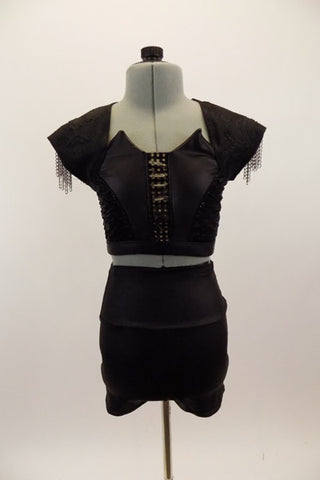 Black pleather high waisted short has matching half top. Bodice has leather weave insert & shoulders are cringle lace with chain accents & lace-up corset back. Front