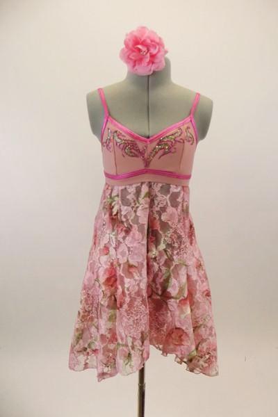 Pale pink bra top has bright pink trim & hand pained design. Brief has matching painted design & attached floral lace skirt that opens at front. Comes with matching floral hair accessory. Front
