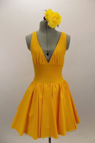 Yellow, halter leotard dress has cross straps and low back. The wide waistband separates bust area & skirt with tulle underlay. Comes with rose hair accessory. Front