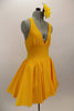 Yellow, halter leotard dress has cross straps and low back. The wide waistband separates bust area & skirt with tulle underlay. Comes with rose hair accessory. Side