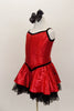 Red textured metallic dress has princess cut bodice and attached skirt with black lace petticoat. Has black piping and snapback closure. Comes with black bow hair accessory. Side