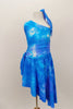 Asymmetrical tank style dress has tie-dye pattern in shade of blues. Sides of the dress are gathered with ties for better fit. Comes with matching hair tie. Front