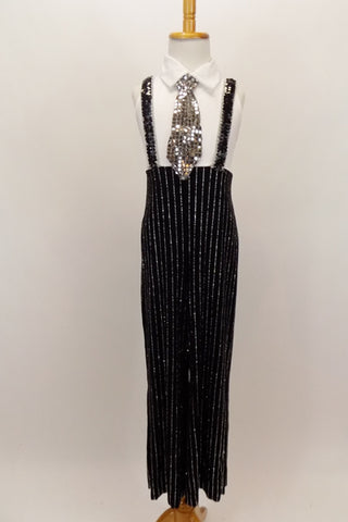 White tank bodice has a keyhole back & attached shirt collar with wide silver tie. The attached high waisted pants have silver pinstripes & sequined suspenders. Comes with matching trilby hat. Front