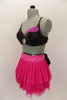 Costume is a  pink layered mesh skirt with crystal covered waistband & large black crystal covered bow at back. Beaded black bra has crystal brooch & appliques. Comes with fancy headband. Left side