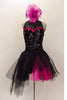  Costume has a black leotard base with lace back & upper & sequined front. Sweetheart neckline has hot-pink accent. BLack pull-on-tulle skirt has pink accent. Comes with large pink hair accessory. Front