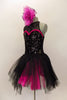  Costume has a black leotard base with lace back & upper & sequined front. Sweetheart neckline has hot-pink accent. BLack pull-on-tulle skirt has pink accent. Comes with large pink hair accessory. Left side