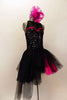  Costume has a black leotard base with lace back & upper & sequined front. Sweetheart neckline has hot-pink accent. BLack pull-on-tulle skirt has pink accent. Comes with large pink hair accessory. Right side