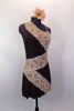 Brown one-shoulder stretch dress has built in brown briefs. Taupe band of wide lace accents the dress is a large zig-zag pattern  Comes with floral hair accessory. Right side