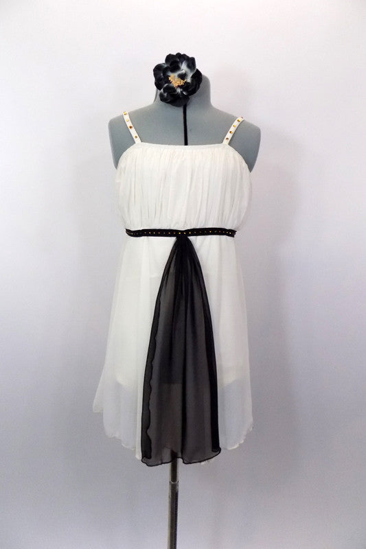 Ivory knee length chiffon dress has empire waist with gathered pleat bust. Has black velvet piping with amber crystals and long black center kerchief accent. Comes with hair accessory. Front