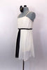 Ivory knee length chiffon dress has empire waist with gathered pleat bust. Has black velvet piping with amber crystals and long black center kerchief accent. Comes with hair accessory. Left side