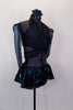 Teal and black sparkle top is a wrap-around bra with halter neck. Has black briefs, matching gauntlets and a teal and black swirled pull on mini hip skirt. Comes with floral hair accessory. Right side
