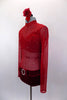 Sheer red short crystaled unitard has long sleeves & red velvet bottom with crystal buckle accent . There is an attached red velvet bra beneath the sheer. Comes with floral hair accessory. Left side