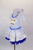 White sailor dress has princess cut seams, pouf sleeves and gold sailor buttons and hand painted anchor design over blue lace petticoat. Comes with sailor hat. Side