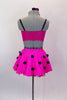 Hot pink skirt has ruffled petticoat with black pom-pom accents. Matching pink & purple leopard print bralette has tie front detail.  Comes with hair accessory. Back