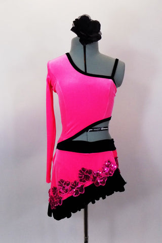 Pink velvet dress with black edging has single shoulder & long right sleeve. Top joined at right side, left side open. Has sequined accents & hair accessory. Front