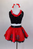 Ladybug themed costume has red skirt with large crystaled blue dots over layers of black lace petticoat. Comes with black sequin top & matching hair accessory. Back