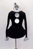 Black velvet long sleeved leotard has large silver button detail, silvers cuffs & silver collar with crystals. Comes with a short velvet skirt with tube hem & hair accessory. Front