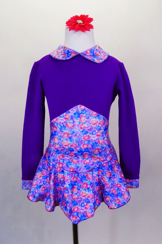 Purple stretch fleece skaters dress has long sleeves and a small floral print Peter Pan collar with matching high peak waist skirt. Comes with hair accessory. Front