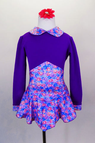 Purple stretch fleece skaters dress has long sleeves and a small floral print Peter Pan collar with matching high peak waist skirt. Comes with hair accessory. Front