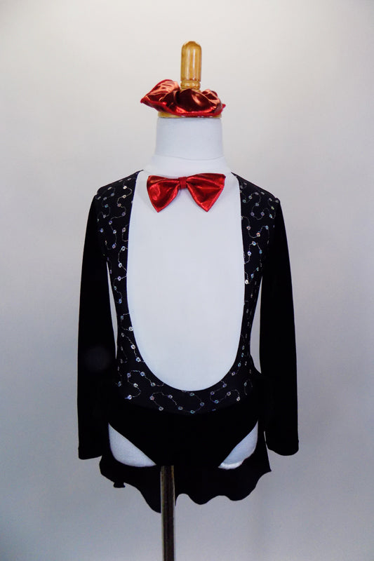 Black velvet dress has long sleeves, high neck & tuxedo-style lapel with red bow tie. Attached skirt is an open front tailcoat. Comes with matching scrunchie. Front