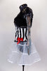 Black & white striped jacket has red bows, black  fur & tattoo sleeves with pouf.  Has white crystal tulle skirt with ribbon accent, attached black shorts & matching mini striped top hat. Left side