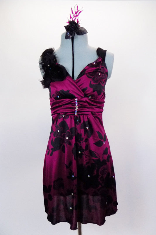 Silk magenta baby-doll dress has  black flower pattern with crystals.  Has wide straps with chiffon roses on shoulder. Comes with black shorts & hair accessory. Front