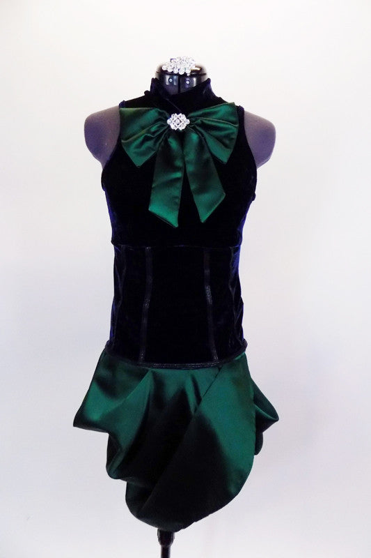 Navy velvet tank top with princess seams has emerald front bow accent with crystal brooch. Matching emerald taffeta pleated & tulip angle skirt complete look. Comes with crystal hair accessory. Front
