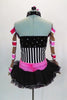 Black-white striped leotard with crystaled halter collar & pink ruffle, has black & pink organza skirt.  Comes with seperate nude-pink sleeves & hair accessory. Back