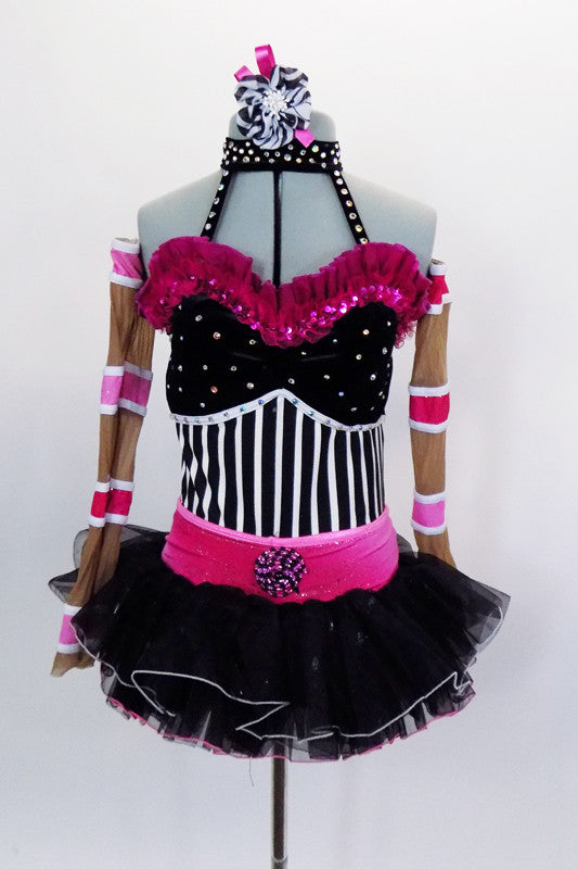 Black-white striped leotard with crystaled halter collar & pink ruffle, has black & pink organza skirt.  Comes with seperate nude-pink sleeves & hair accessory. Front