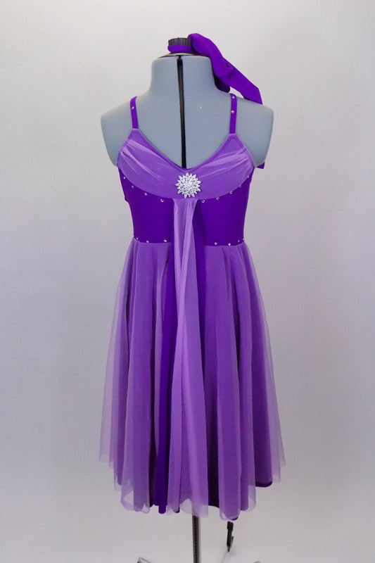 Purple knee length dress has crystal covered shoulder straps. Gathered lavender mesh covers neckline, skirt & center kerchief. Comes with panty & hair accessory. Front