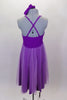 Purple knee length dress has crystal covered shoulder straps. Gathered lavender mesh covers neckline, skirt & center kerchief. Comes with panty & hair accessory. Back
