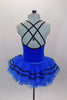 Royal blue ballet tutu has layers of blue ruffled tricot with black ribbon accented. The attached blue velvet bodice has black cross straps. Comes with floral hair accessory. Back