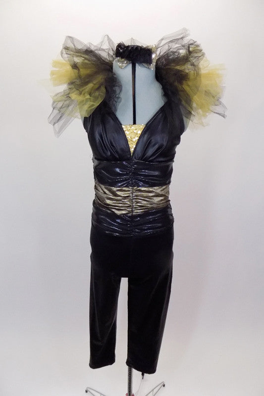 Black leather-look full unitard has triangle halter bra, wide gold waistband & open back.  The collar has layers of gold & black tulle tufting. Comes with hat. Front