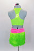 Neon green fringe skirt has pink gathered waistband with large crystal buckle. Comes with matching green racerback half-top & hair accessory. Back