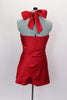 Red satin baby-doll top has padded bust & ties at neck. Pleated bust is covered extensively with Swarovski crystals. Comes with black briefs & hair accessory. Back