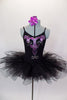 Black leotard with open loop back has had painted, purple designs &  crystals along back & torso. Comes with pull on black tutu & floral hair accessory. Front