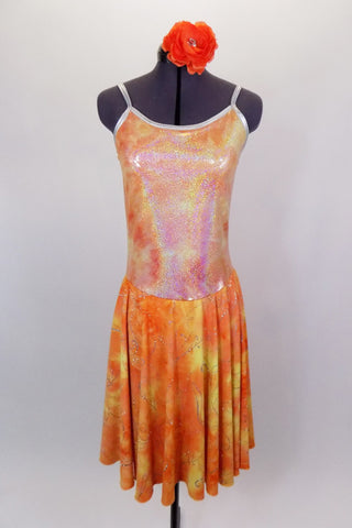 Orange & yellow dress has knee length flowing skirt with silver swirl detail. The bodice is an iridescent camisole with silver edging. Comes with hair accessory. Front