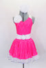 Neon pink dress has white spandex belt with crystal buckle. Has white ruffled underskirt for volume. Keyhole back attaches by a ring. Comes with hair accessory. Front