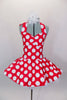 Red 50s style halter dress has white polka dot print. The attached white tricot underskirt adds volume. Has adjustable nude straps, attached briefs & hair accessory. Front