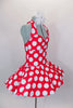 Red 50s style halter dress has white polka dot print. The attached white tricot underskirt adds volume. Has adjustable nude straps, attached briefs & hair accessory. Side