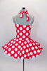 Red 50s style halter dress has white polka dot print. The attached white tricot underskirt adds volume. Has adjustable nude straps, attached briefs & hair accessory. Back