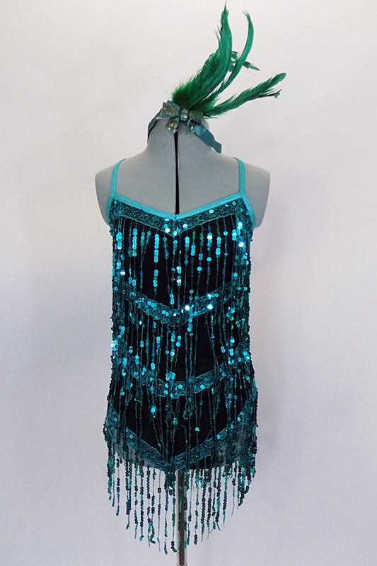 Teal sequin fringe details this sensational black matte jersey dress. Metallic binding trims the camisole neckline. Comes with built in leotard & hair accessory. Front