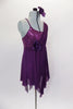 Purple leotard dress has stretch mesh overlay & sequin spandex camisole bodice with stretch mesh cross overlay & rose accent. Comes with rose hair accessory. Right side