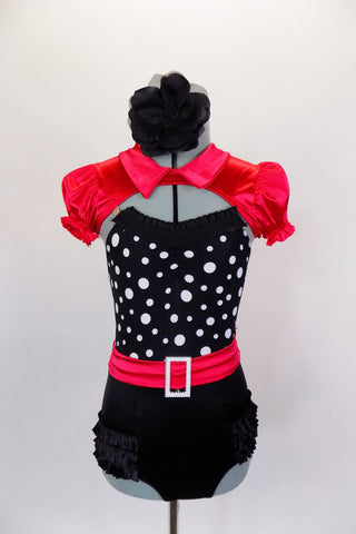 Leotard has black ruffled panty &  black bodice with white polka dots, ruffle & red belt with crystal buckle. Comes with red satin mini-shrug & hair accessory. Front
