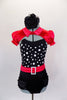 Leotard has black ruffled panty &  black bodice with white polka dots, ruffle & red belt with crystal buckle. Comes with red satin mini-shrug & hair accessory. Front